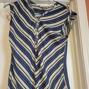 Sleeveless black, white and blue blouse